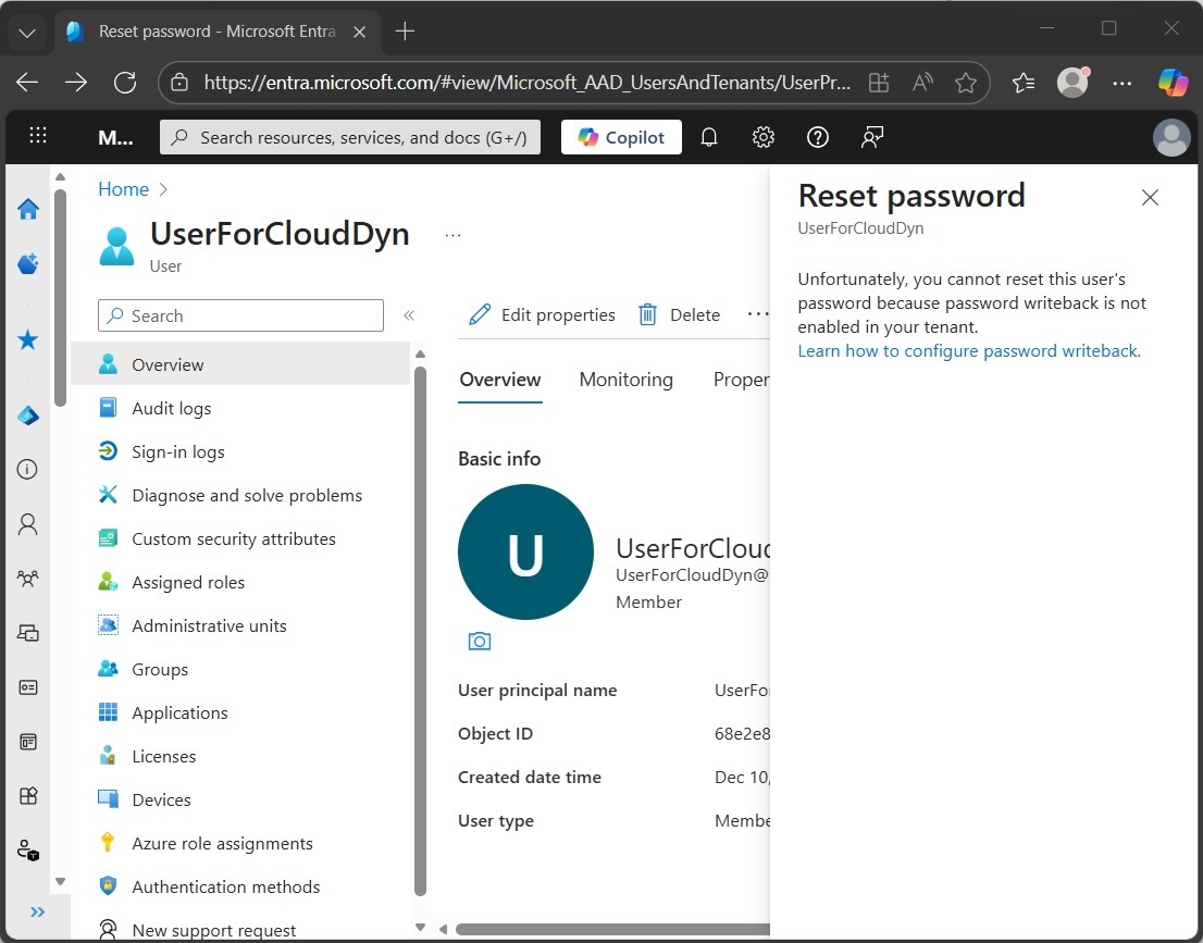 Microsoft Entra admin center view demonstrating an administrative deadlock: the password reset is blocked because the cloud identity remains linked to an on-premises source that has already expired and been purged from Active Directory